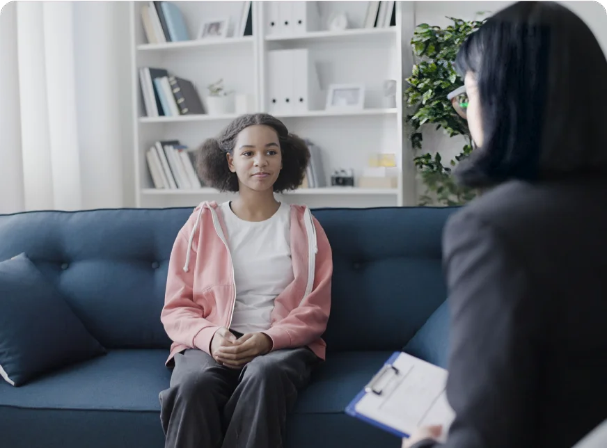 Child speaking to mental health provider